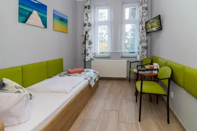 Łóżko lub łóżka w pokoju w obiekcie Willa Diament