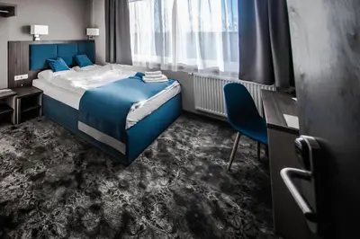 Łóżko lub łóżka w pokoju w obiekcie Hotel Sleep Wrocław
