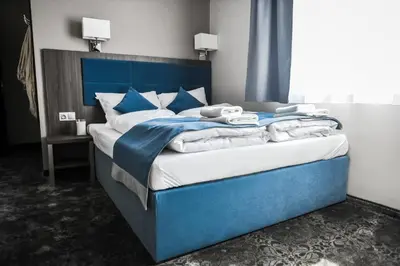 Łóżko lub łóżka w pokoju w obiekcie Hotel Sleep Wrocław