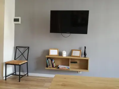 Telewizja i/lub zestaw kina domowego w obiekcie Novitas Apartments