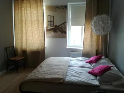 Łóżko lub łóżka w pokoju w obiekcie Novitas Apartments