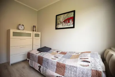 Łóżko lub łóżka w pokoju w obiekcie JDK Apartamenty Podmiejska 38m2 5-osobowy