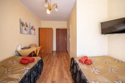 Łóżko lub łóżka w pokoju w obiekcie Dom Wypoczynkowy Rybniczanka-Wanda Lądek-Zdrój w górach