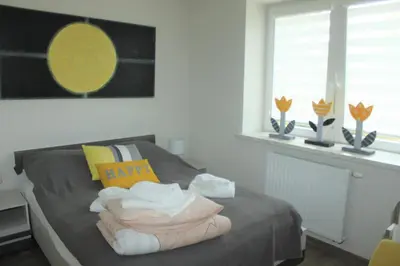 Łóżko lub łóżka w pokoju w obiekcie Apartament Malwina