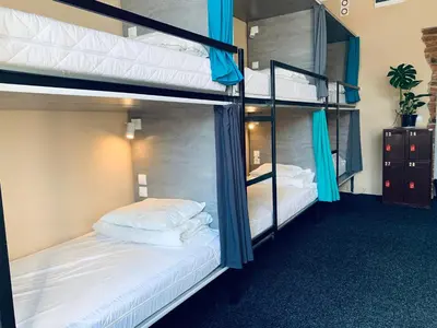Łóżko lub łóżka w pokoju w obiekcie Chilli Hostel