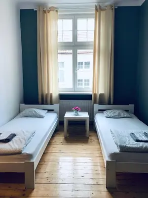 Łóżko lub łóżka w pokoju w obiekcie Chilli Hostel