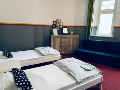 Łóżko lub łóżka w pokoju w obiekcie Chilli Hostel