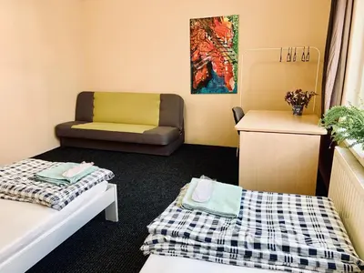 Łóżko lub łóżka w pokoju w obiekcie Chilli Hostel