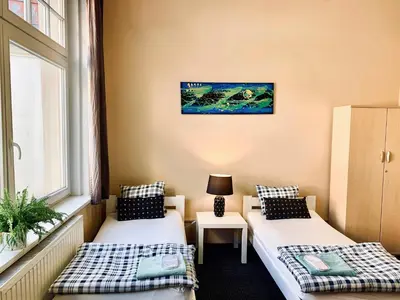 Łóżko lub łóżka w pokoju w obiekcie Chilli Hostel