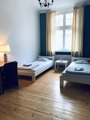 Łóżko lub łóżka w pokoju w obiekcie Chilli Hostel