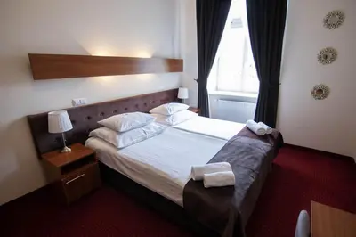 Łóżko lub łóżka w pokoju w obiekcie Hotel Zamkowy