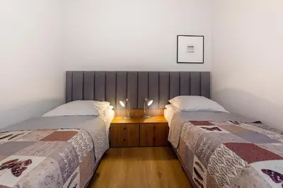 Łóżko lub łóżka w pokoju w obiekcie Apartamenty Familijne