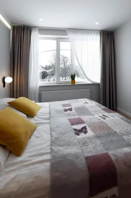 Łóżko lub łóżka w pokoju w obiekcie Apartamenty Familijne