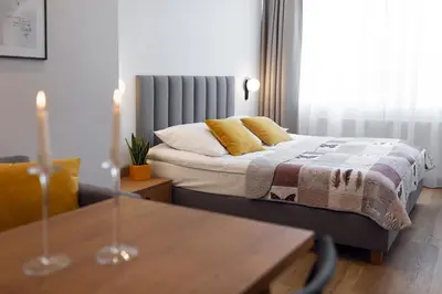 Łóżko lub łóżka w pokoju w obiekcie Apartamenty Familijne