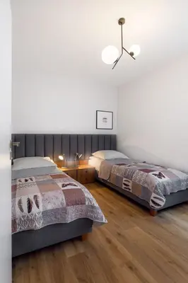 Łóżko lub łóżka w pokoju w obiekcie Apartamenty Familijne