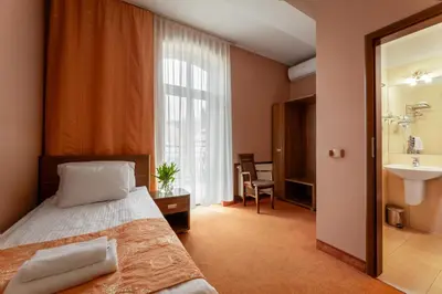 Łóżko lub łóżka w pokoju w obiekcie Paria Hotel