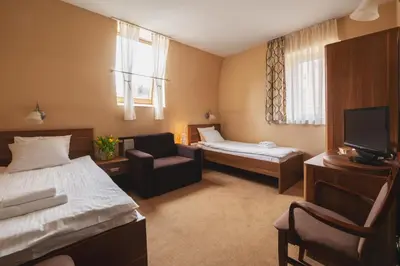 Łóżko lub łóżka w pokoju w obiekcie Paria Hotel