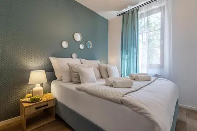Łóżko lub łóżka w pokoju w obiekcie Apartament24 Stare Miasto Wrocław