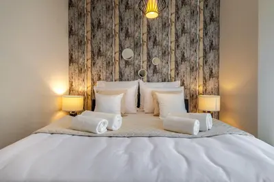Łóżko lub łóżka w pokoju w obiekcie Apartament24 Stare Miasto Wrocław