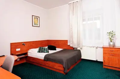 Łóżko lub łóżka w pokoju w obiekcie Hotel Preemier