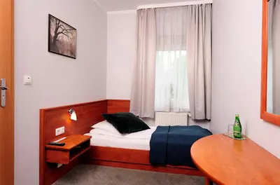 Łóżko lub łóżka w pokoju w obiekcie Hotel Preemier