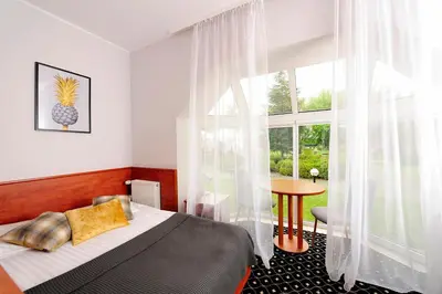 Łóżko lub łóżka w pokoju w obiekcie Hotel Preemier