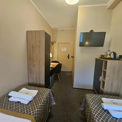 Łóżko lub łóżka w pokoju w obiekcie Willa Kłodzko-Zacisze - Wellness & Fitness