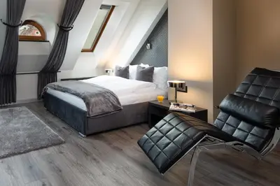 Łóżko lub łóżka w pokoju w obiekcie Aparthotel New Lux