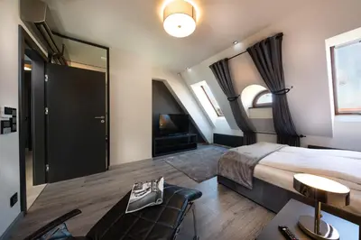 Łóżko lub łóżka w pokoju w obiekcie Aparthotel New Lux