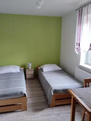 Łóżko lub łóżka w pokoju w obiekcie Agroturystyka u Pawła i Asi