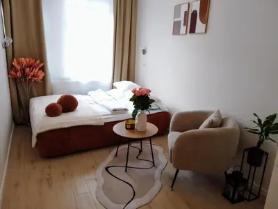 Łóżko lub łóżka w pokoju w obiekcie Duarte Apartamenty
