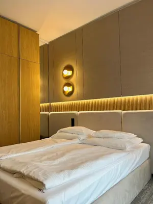Łóżko lub łóżka w pokoju w obiekcie Hotel Arkas