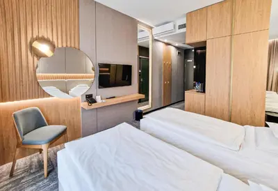 Łóżko lub łóżka w pokoju w obiekcie Hotel Arkas