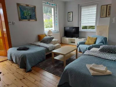 Łóżko lub łóżka w pokoju w obiekcie Apartament na Rybnej