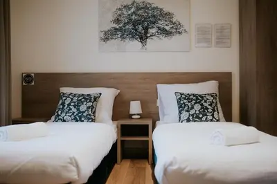 Łóżko lub łóżka w pokoju w obiekcie Villa Garden