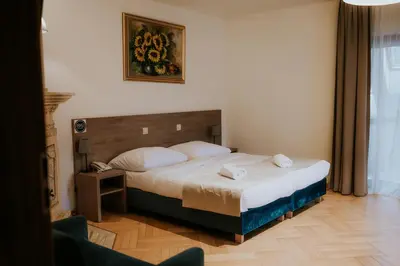 Łóżko lub łóżka w pokoju w obiekcie Villa Garden