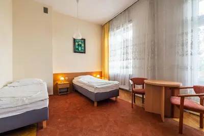 Łóżko lub łóżka w pokoju w obiekcie Savoy Wrocław