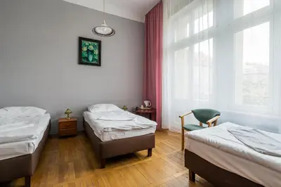 Łóżko lub łóżka w pokoju w obiekcie Savoy Wrocław