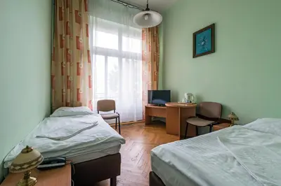 Łóżko lub łóżka w pokoju w obiekcie Savoy Wrocław