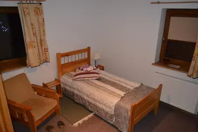 Łóżko lub łóżka w pokoju w obiekcie Koliba