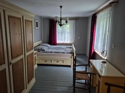 Łóżko lub łóżka w pokoju w obiekcie Gospodarstwo Agroturystyczne Pałac Heymanna - Oficyna