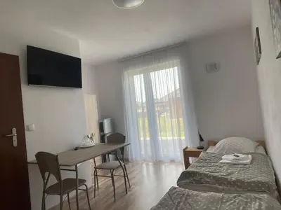 Łóżko lub łóżka w pokoju w obiekcie Różana 51