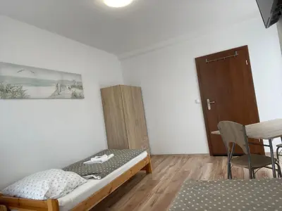 Łóżko lub łóżka w pokoju w obiekcie Różana 51