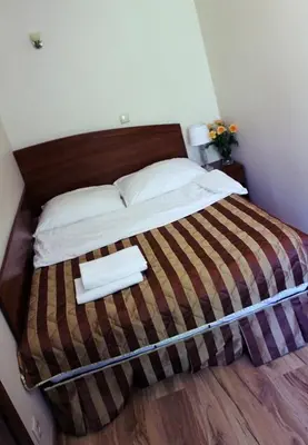 Łóżko lub łóżka w pokoju w obiekcie Pensjonat Perła Polanicy