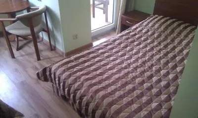Łóżko lub łóżka w pokoju w obiekcie Pensjonat Perła Polanicy