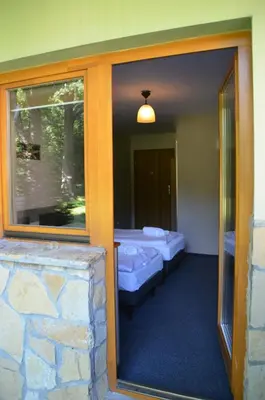 Łóżko lub łóżka w pokoju w obiekcie Hotel Tenis