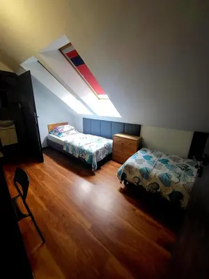 Łóżko lub łóżka w pokoju w obiekcie M Hostel