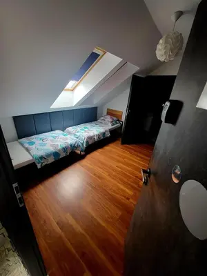 Łóżko lub łóżka w pokoju w obiekcie M Hostel