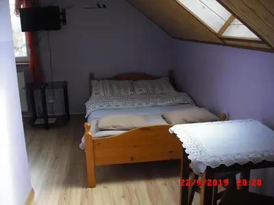 Łóżko lub łóżka w pokoju w obiekcie Pokoje Gościnne HANA