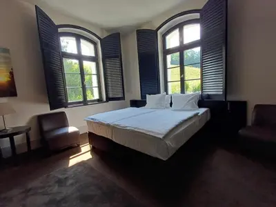 Łóżko lub łóżka w pokoju w obiekcie Hotel Pałac Jugowice